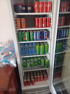 a refrigerator filled with lots of soda and sodas at Apartmani Herceg in Gacko