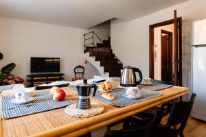 a dining room table with food on top of it at Palazzina Storica al Mare, Rapallo in Rapallo