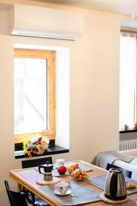 a table with fruit on it in a living room at Palazzina Storica al Mare, Rapallo in Rapallo +14 photos