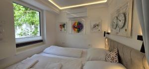 a living room with a couch and a window at Cozy Tiny-House - ComfyHome Apartments in Stuttgart