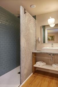 a bathroom with a sink and a mirror at Olivi1948 - Boutique Guest House in Usúrbil +45 photos