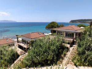 an aerial view of a house on the beach at Turtle Home in Skala