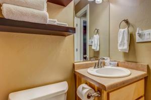 a bathroom with a sink and a toilet and a mirror at La Plata View in Durango +58 photos