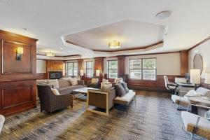 a large living room with couches and a table at Blue River Escapade in Breckenridge