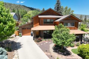 a large wooden house with a driveway at Durango Deluxe Townhome in Durango