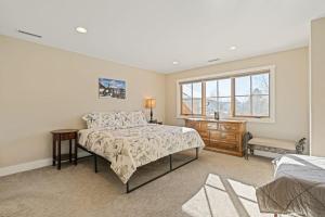 a bedroom with a bed and a window at Durango Deluxe Townhome in Durango