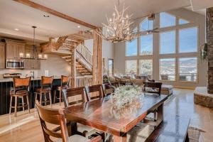 a dining room and living room with a table and chairs at Cutbow Lodge in South Fork
