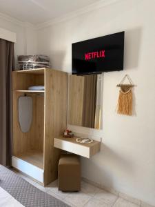 a dressing room with a mirror and a sink at Villa Hara Suites in Paralia Katerinis +77 photos