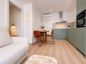 a living room with a couch and a table at YBH Ocean Boutique in Vigo