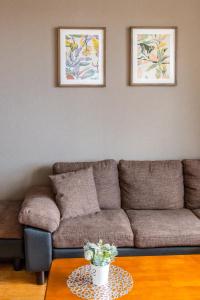 a living room with a couch and a table at 青柳館 Aoyagi-Kan in Hakodate