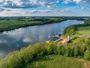 an aerial view of a river with trees at Holenderka nad Szelmentem in Jeleniewo