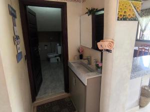a bathroom with a sink and a toilet and a mirror at Villa khaddouj Marrakech in Marrakesh +26 photos