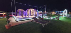 a view of a building at night with lights at Maremonti Glamping in Ancarano