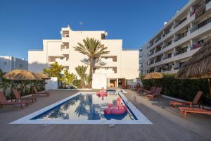 a swimming pool with a pool noodle in a resort at The Loft House Ibiza in Santa Eularia des Riu