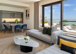 a living room with a couch and a table at Ray Hotel by Cloud 7 in Kuwait