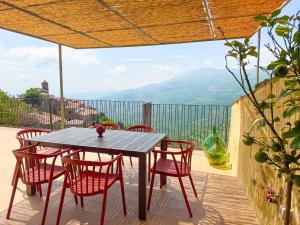 a table and chairs on a balcony with a view at Rocha Suites in Rocca Cilento +52 photos