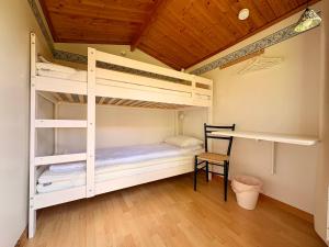 a bedroom with two bunk beds and a wooden ceiling at B&B Parkgården Leksand in Leksand +223 photos