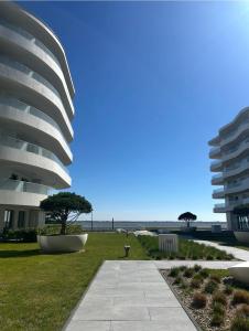 a view of a building with the beach in the background at PEARL COAST Luxury Rogowo Pool Beach in Rogowo +10 photos