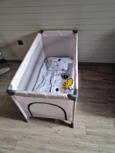 a small pink crib with a hello kitty blanket at Altstadt Quartier Hallenberg - Modernes Ferienappartment in Hallenberg