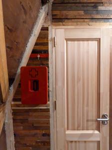 a bathroom with a door with a cross sign on it at Knowledge Temple - Keni in Kapan