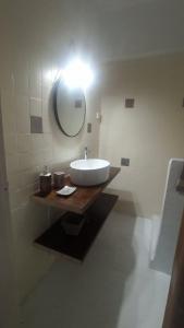 a bathroom with a sink and a mirror at evgenias studio 2 in Gaios