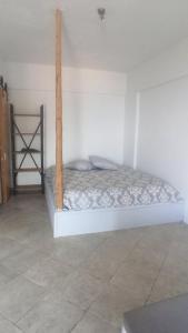 a small bed in a room with at evgenias studio 2 in Gaios