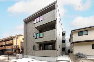 an exterior view of a building with colorful windows at Anecis名楽町 in Nagoya