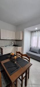 a kitchen and dining room with a table and chairs at Imeros Summer Home in Ímeros