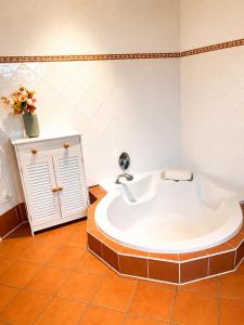 a bathroom with a large tub in a room at Haus an der Bachschleife in Arnstadt +15 photos