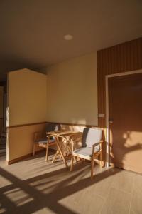 a room with a table and chairs and a door at Ko Tao Paradise Resort in Ko Tao +25 photos