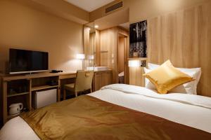 Giường trong phòng chung tại Hotel Vista Sendai