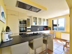 a kitchen with a counter with a stove top oven at Amaya in Begur
