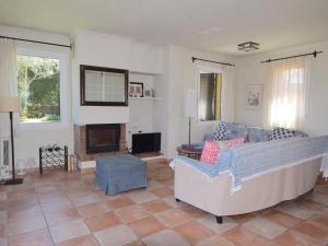 a living room with a couch and a fireplace at Amaya in Begur