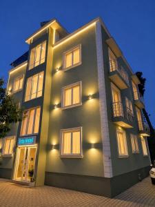a large building with lights on the side of it at Hotel Erta in Golem
