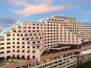 a large white building with a novation sign on it at Novotel Sydney Darling Harbour in Sydney