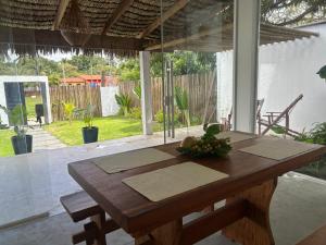 a wooden table in the middle of a room at Casa Rio - Santo Amaro in Santo Amaro