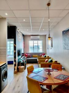 a living room with a table and a couch at Pepper Korrel - Paarl - Self Catering Apartment in Paarl