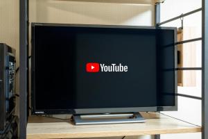 a television screen with the youtube logo on it at Atlantis Tengachaya - Whole house rental in Osaka