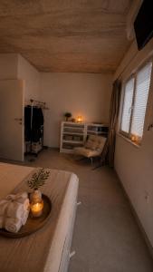 a living room with a table with candles on it at Apartment Bunja No3 in Drage