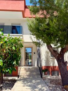 a house with a staircase leading to the front door at Violahouse in Bari