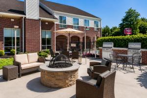 a patio with a table and chairs and a fire pit at Residence Inn Philadelphia Willow Grove in Horsham
