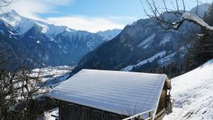 a snow covered roof of a building on a snowy mountain at Haus Kropfa in Hippach +26 photos