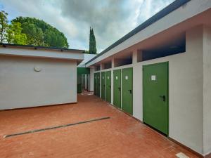 a row of green lockers in a building at Camping Volterra in Volterra +25 photos
