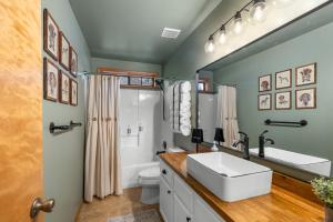 a bathroom with a sink and a toilet at Spacious Flagstaff A-Frame Casita Getaway in Flagstaff +45 photos