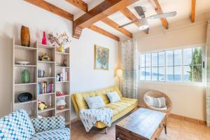 a living room with a couch and a table at Blue Emi Altea Hills in Altea la Vieja