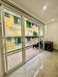 a dog standing in a room with a large window at Lumina Haven in Thượng Lôi