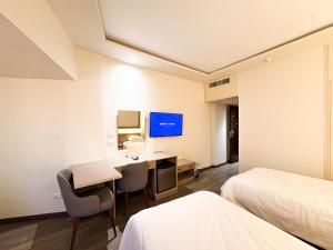 a hotel room with a desk and a bed at Beirut Hotel Cairo in Cairo
