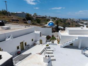 a view from the roof of a white building at Palm Tree Hill in Oia