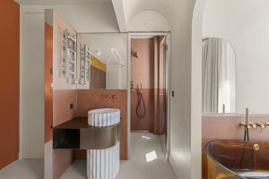 a bathroom with a sink and a shower and a tub at Naomi Cannes in Cannes +72 photos