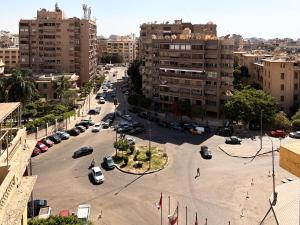a city street with cars parked in a parking lot at Beirut Hotel Cairo in Cairo